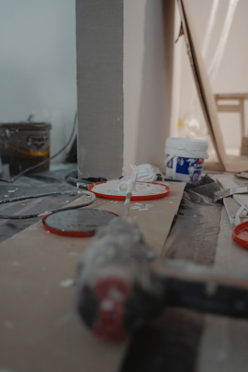 Close-up view of a construction site with tools and materials used for home renovation.